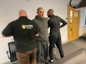 Instructor demonstrating safe PMVA hold