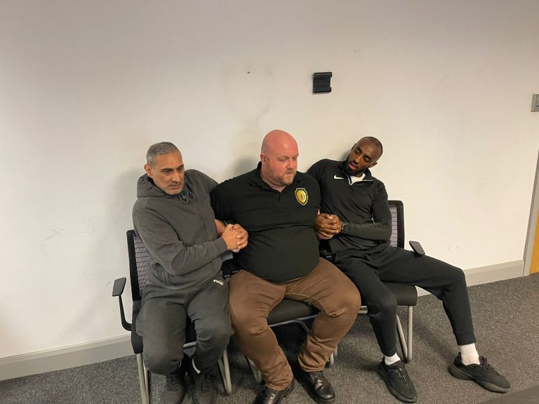 Instructor demonstrating safe PMVA hold