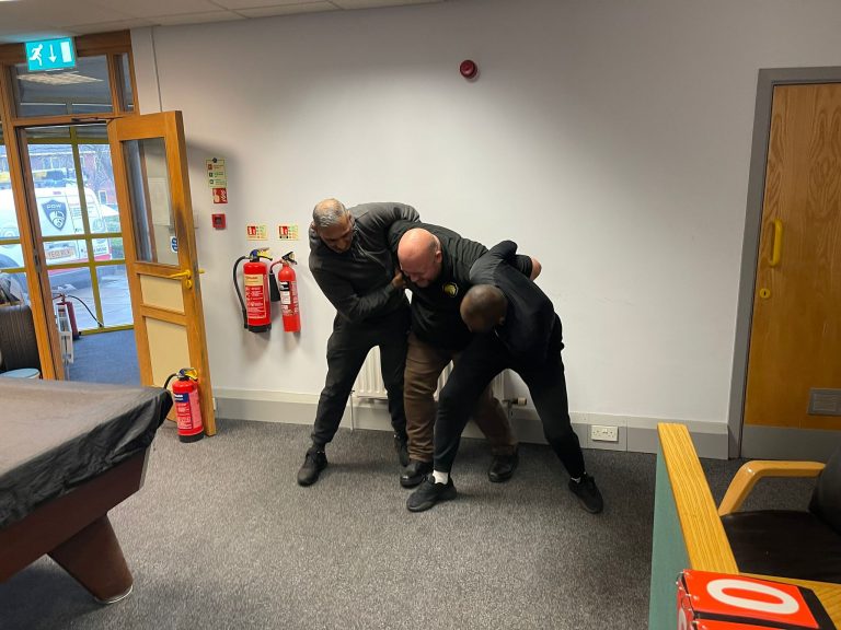 Instructor demonstrating safe PMVA hold
